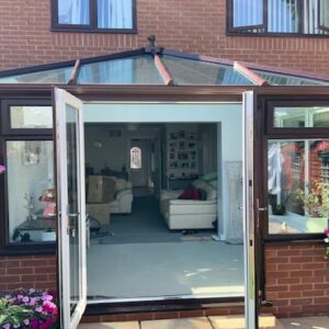 Brown conservatory with open doors
